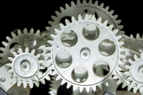 Close view of old clock mechanism with gears and cogs. Conceptual photo for y Stock Photos