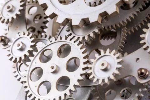 Close view of old clock mechanism with gears and cogs. Conceptual photo for y Stock Photos