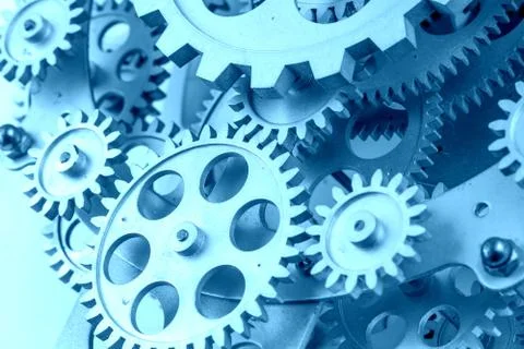 Close view of old clock mechanism with gears and cogs. Conceptual photo for y Stock Photos
