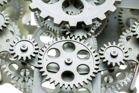 Close view of old clock mechanism with gears and cogs. Conceptual photo for y Stock Photos
