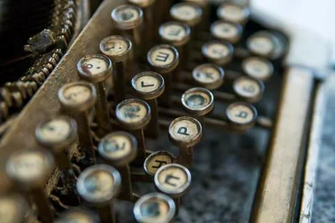 Close up view on an old dirty broken antique typewriter machine keys with Stock Photos