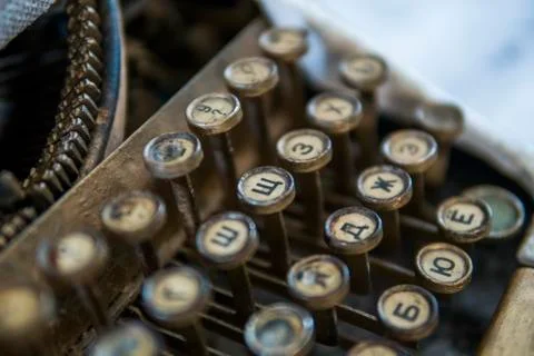 Close up view on an old dirty broken antique typewriter machine keys with Stock Photos