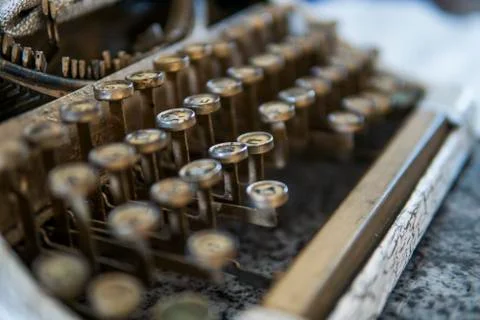 Close up view on an old dirty broken antique typewriter machine keys with Stock Photos
