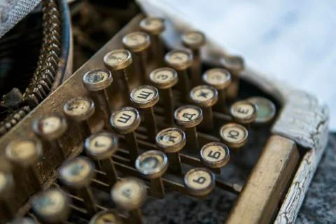 Close up view on an old dirty broken antique typewriter machine keys with Stock Photos