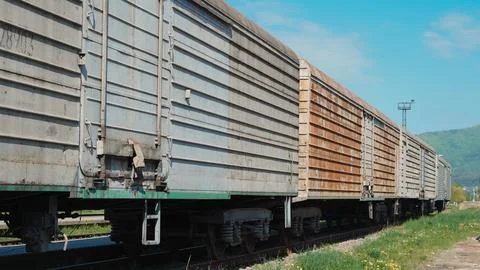 Close up view of old freight train at railway station in urban environment Stock Photos