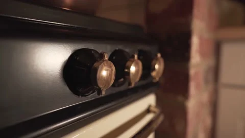 Close up view of old kitchen fire knobs oven. light reflections and 動画素材 148313881