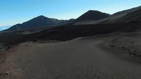 Close up view of old lava flow with dark ashes &amp; rocks during sunrise in Hawaii Video stock 196917650
