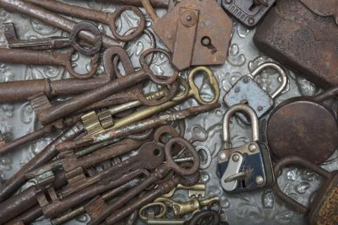 Close up view of old  padlock and keys on a metal  background Stock Photos