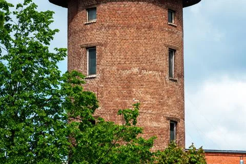 Close view of a old red brick water tower against blue sky Stock Photos
