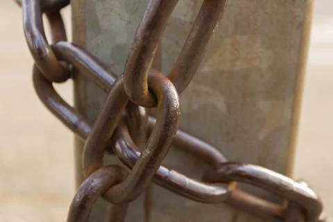 Close-up view of old rusty chain links. Stock Photos