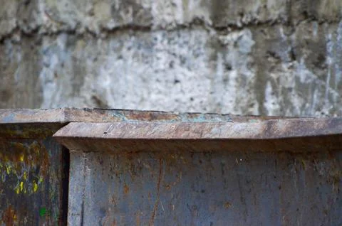 Close-up view of old rusty trash bins. Stock Photos