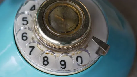 Close up view of old style telephone dialing. Rotating numbers 911 Stock Footage 127815768