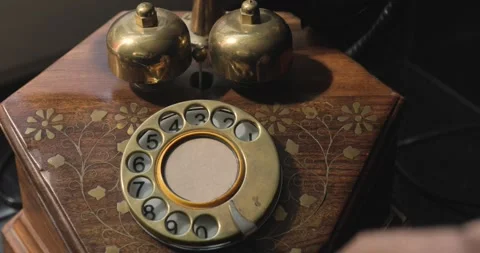 Close-up view on an old style telephone dial. Rotating numbers by finger. Stock-Footage 154723670