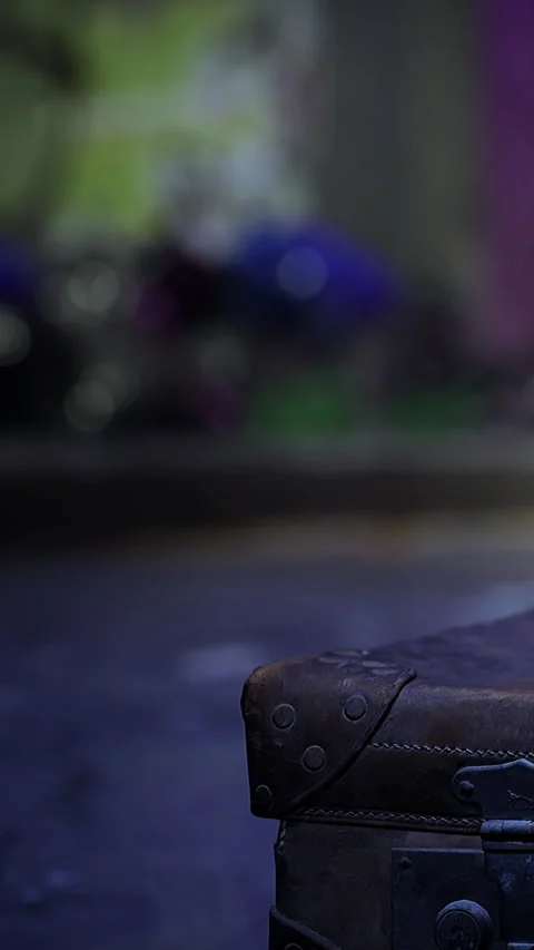 Close view of an old suitcase on a wet street near colorful lights at night Stock Footage 334173837