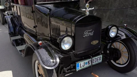 Close up view of an old vintage Ford Model T (Tin Lizzie) in medieval town Stock Footage 203850800