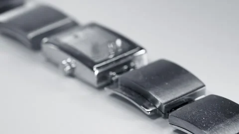 Close up view of old wrist watch with steel strap on white background Video stock 324554483