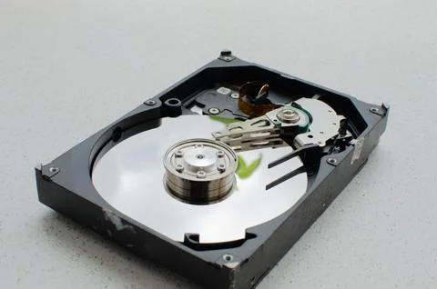 Close-up view of an open HDD, showing its magnetic disks and read heads. Di.. Fotos Stock