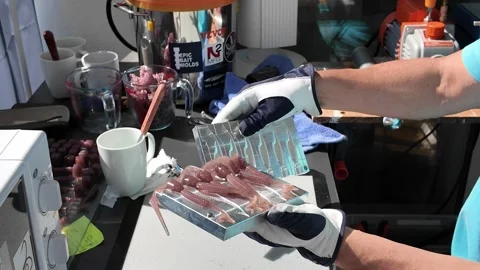 Close up view of opening aluminum mold with freshly cast Epic Slouch 3.2 inch Stock Footage 314970204