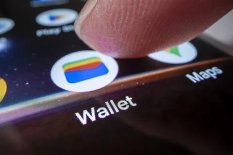 Close-up view of opening Google Wallet app on an Android phone Stock Photos