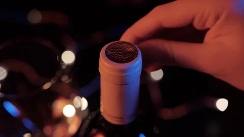 Close up view of opening a wine bottle Opening a wine bottledark background Stock-Footage 120333451