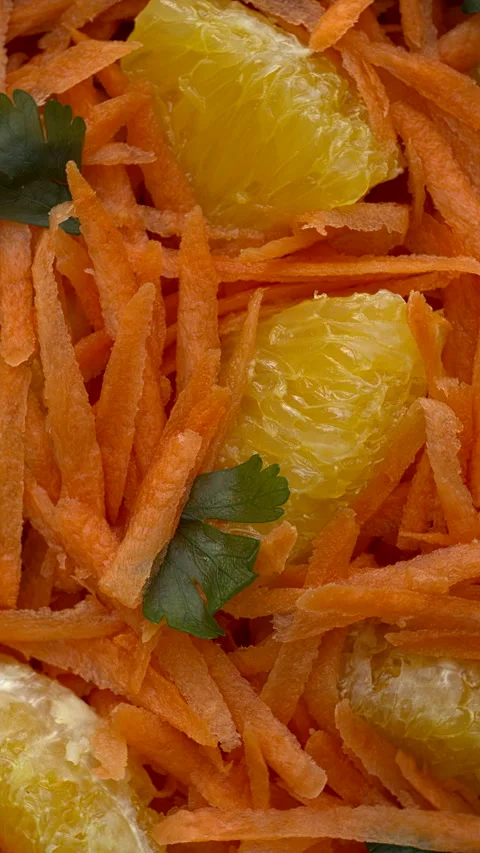 Close-up view of orange and grated carrot salad. 스톡 동영상 331290726