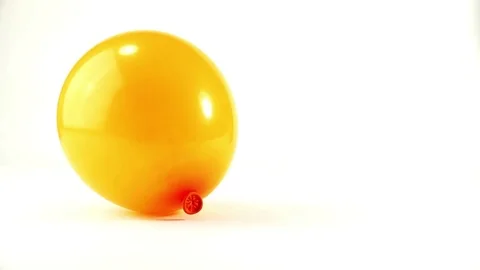 Close-up View of Orange Balloon on white background Stock Footage 72427597