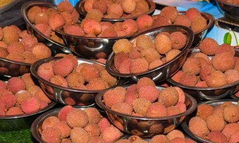 Close up view of organic lychee piled for sale. Stock Photos