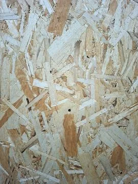 Close up view of oriented strand board showing compressed wood flakes on it.. Stock Photos