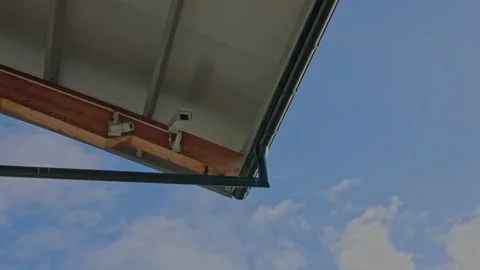Close up view of outdoor surveillance camera under roof of house. Sweden. Stock Footage 220445958