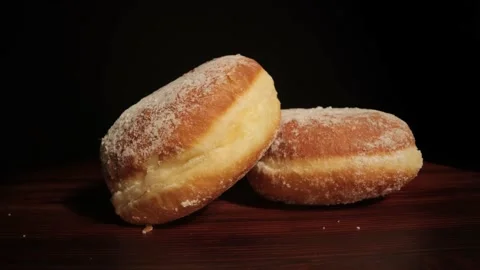 Close up view over fresh baked doughnuts Stock Footage 149382368