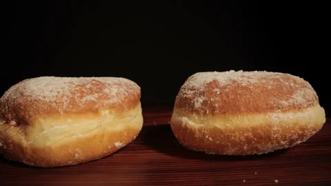 Close up view over fresh baked doughnuts Stock Footage 149382388