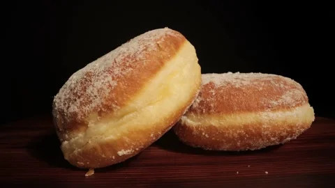 Close up view over fresh baked doughnuts Stock Footage 149382427