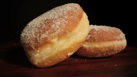 Close up view over fresh baked doughnuts Stock Footage 149382479