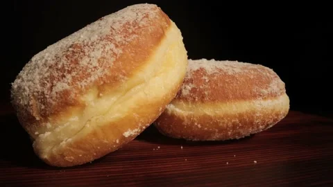 Close up view over fresh baked doughnuts Stock Footage 149382490