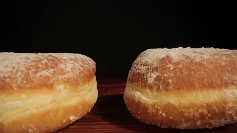 Close up view over fresh baked doughnuts Stock Footage 149382786