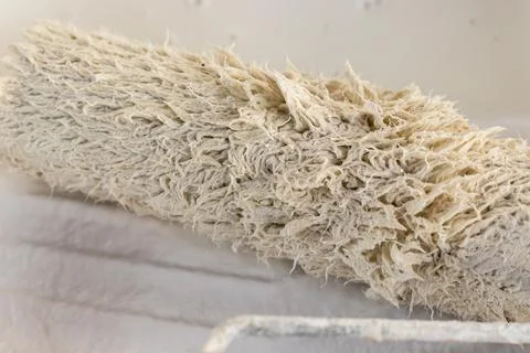 A close up view of a paint roll with white colour Stock Photos