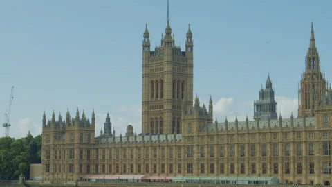 Close-up view of the Palace of Westminster under a bright blue sky on a sunny Video stock 319594586