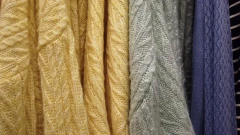 Close up view, panorama. Variety of clothes hanging on rack in boutique. Warm Stock Footage 157367461