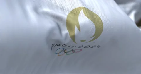 Close-up view of the Paris 2024 Summer Olympics flag waving in the wind Stock Footage 219807941