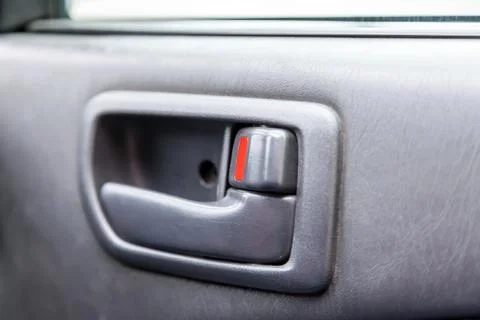 A close-up view of a part of the interior of a modern car with a view of a do Stock Photos