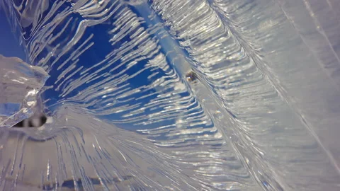 Close view on part of luminous ice sculpture, glassy glacial frozen artwork Stock Footage 165149407