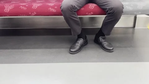 Close Up View of Passenger Legs Sitting Inside Commuter Train Stock Footage 337521846