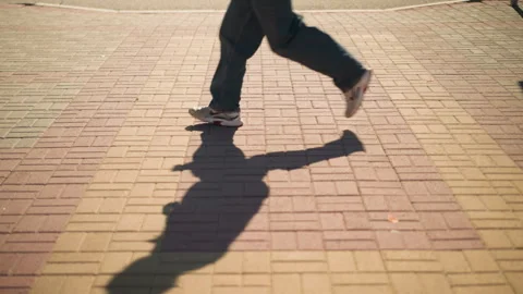Close-up view of patterned sidewalk tiles, sunlit urban surface Stock Footage 305532132
