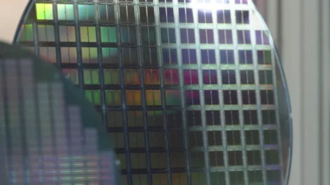 Close-up view of patterned silicon semiconductor wafers with reflective Stock Footage 333839472