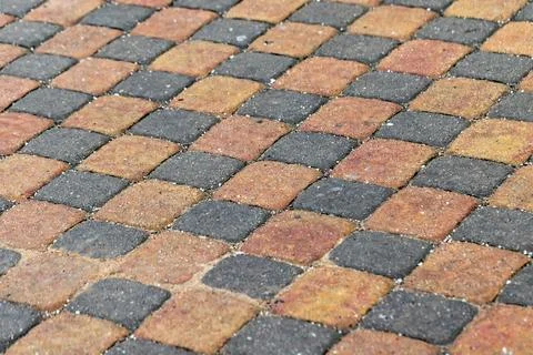A close-up view of a patterned walkway, background photo Stock Photos