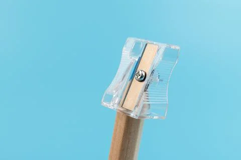 Close up view of a pencil being sharpened in a transparent pencil sharpener Stock Photos