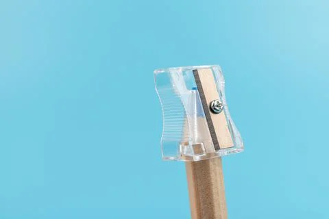 Close up view of a pencil being sharpened in a transparent pencil sharpener Foto stock