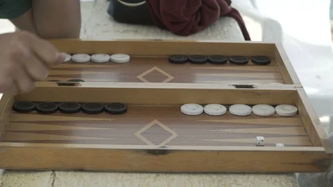 A close view of people play backgammon and dices Stockbeeldmateriaal 90447892