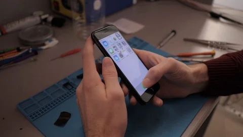 Close view person checks iphone loudspeaker workability Stock Footage 104656062