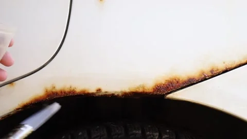 Close up view of person hand apply home use car rust stop liquid. Stock-Footage 236632237
